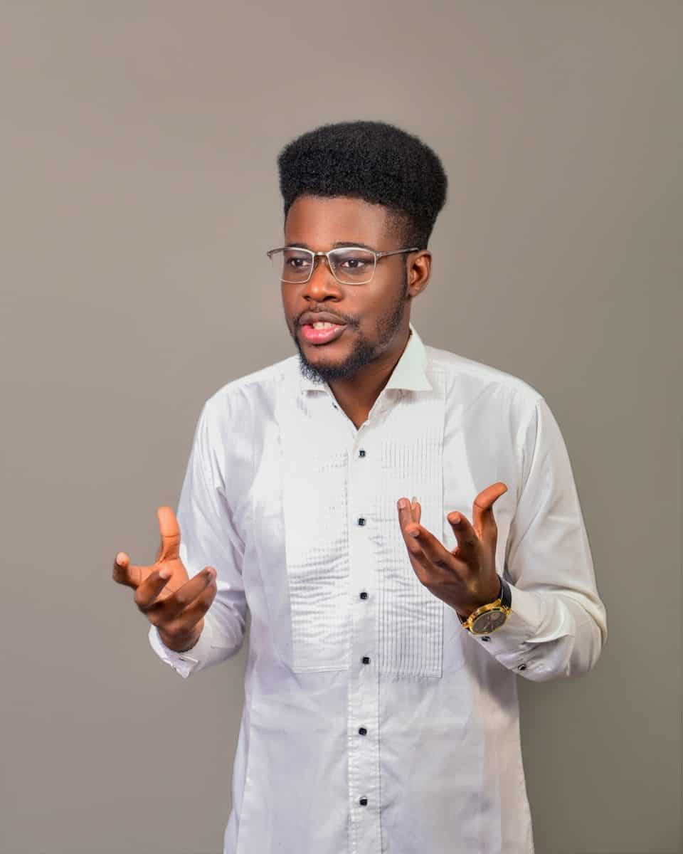 A man wearing glasses and a white shirt