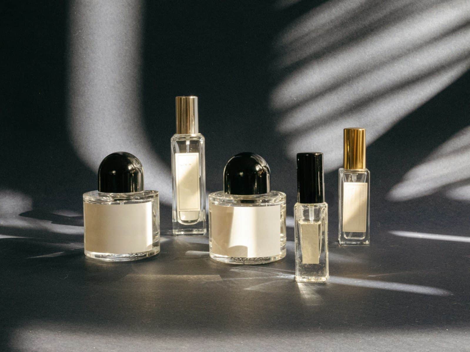 A group of perfume bottles sitting on top of a table