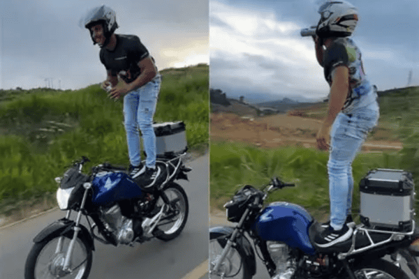 Jovem desafia o perigo ao ficar em pé sobre moto em movimento