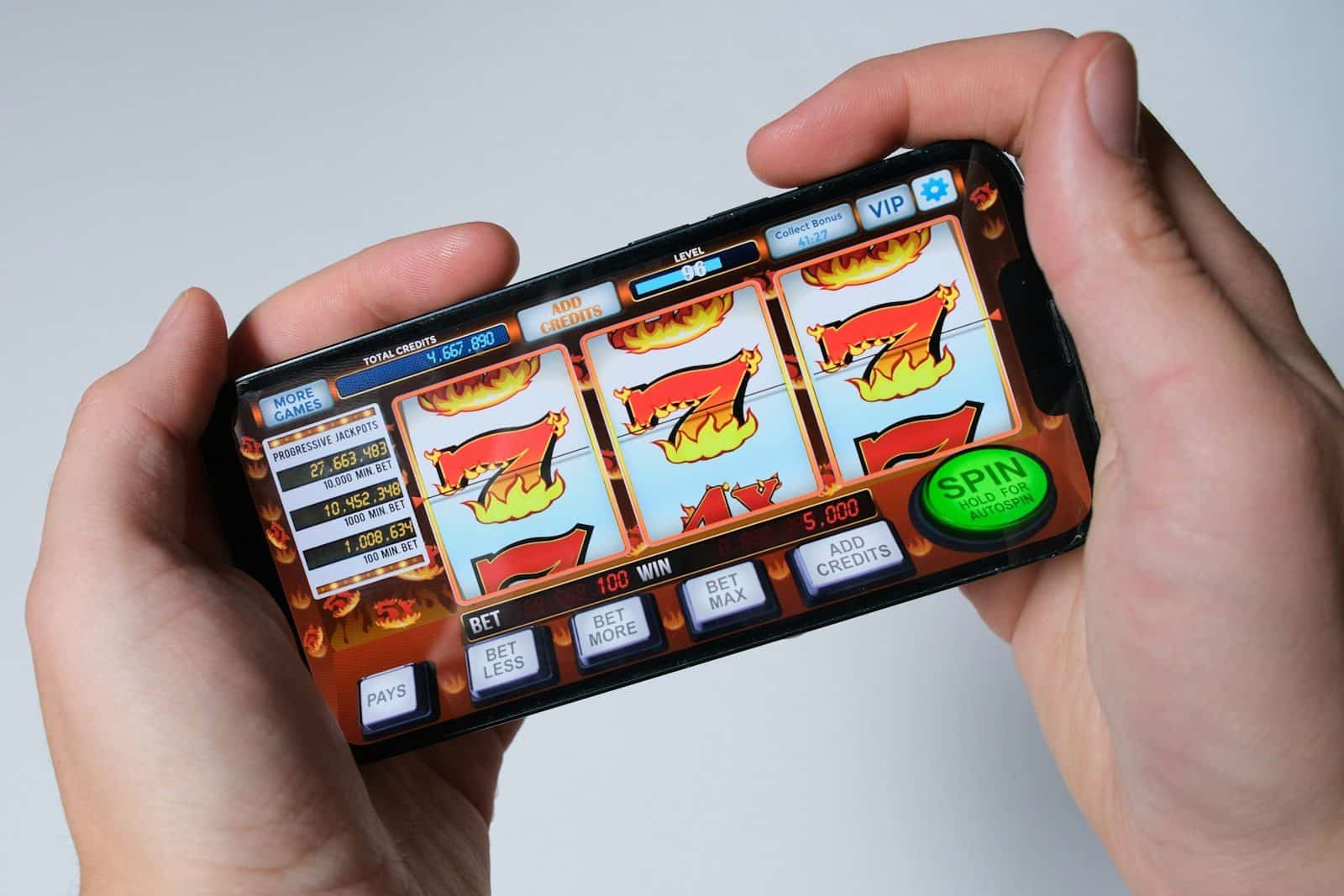 Someone is playing a mobile slot machine game