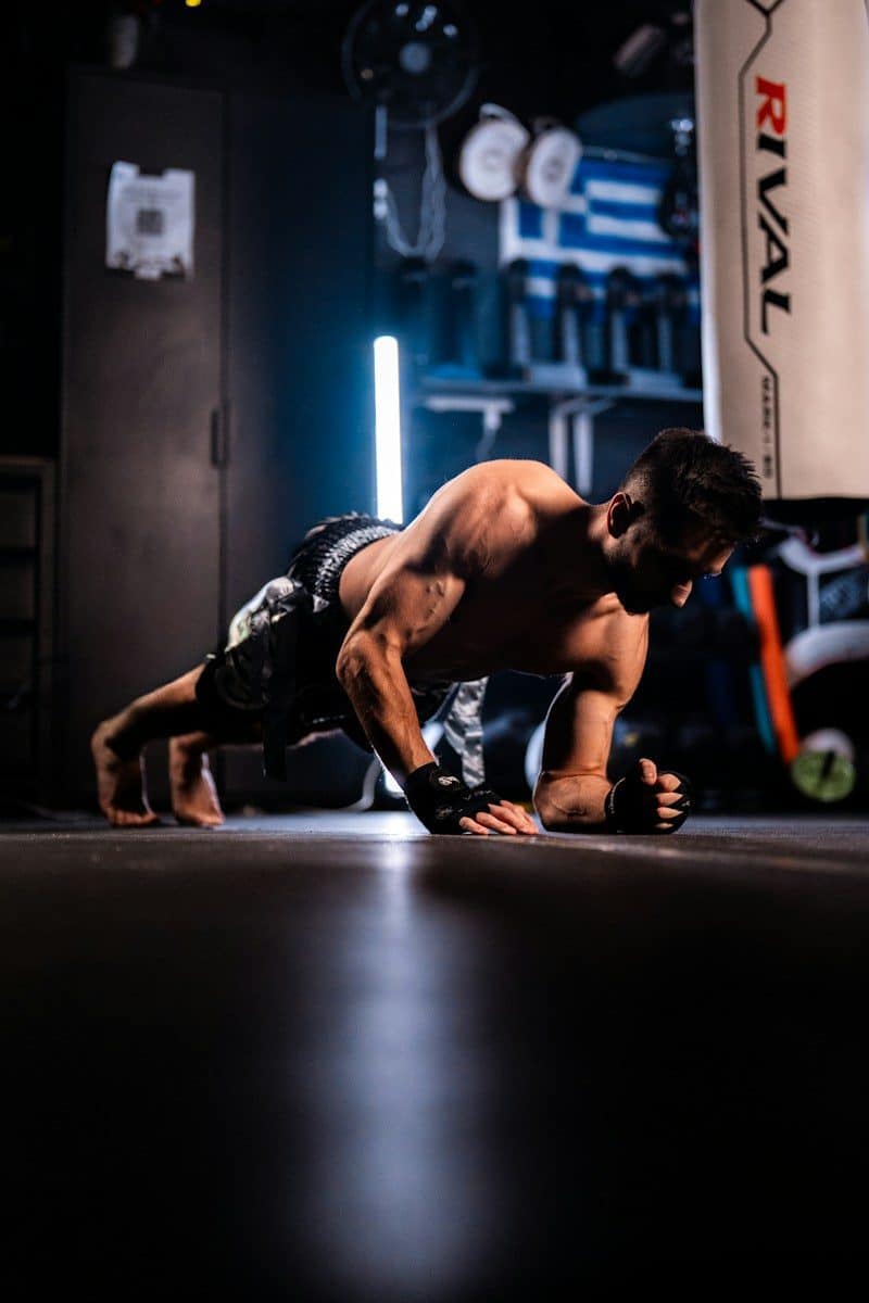 Man doing a plank exercise in a gym